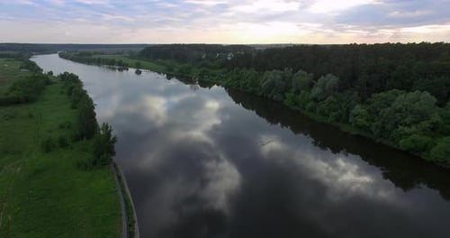 A River Surface, Reflecting Cloudy Sky