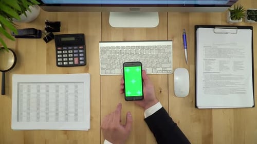 Business Man Using Green Screen Phone And Computer At Office