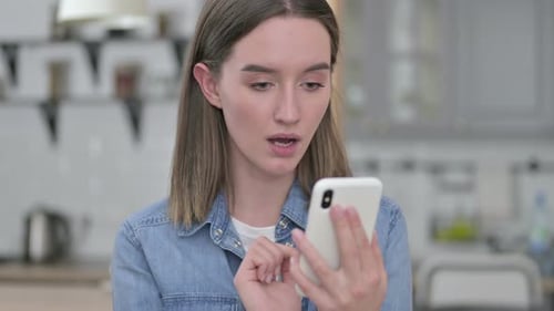 Woman Reacts to Phone News, Close Up Shot
