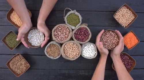 Overhead Shot of Various Legumes on Wooden Table