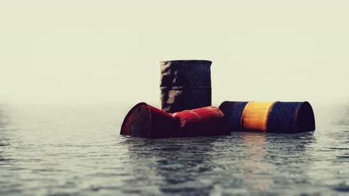 Old Rusty Barrels Oil in Sea Water Illustrates the Pollution of Environment