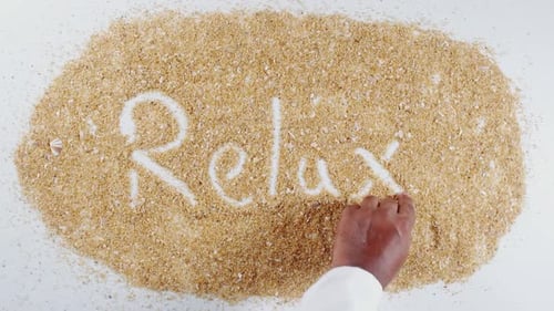 Écriture manuelle sur Sand Relax