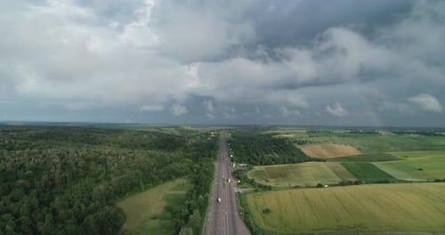 Highway On A Background Of Cloudy Sky With Low Cloud