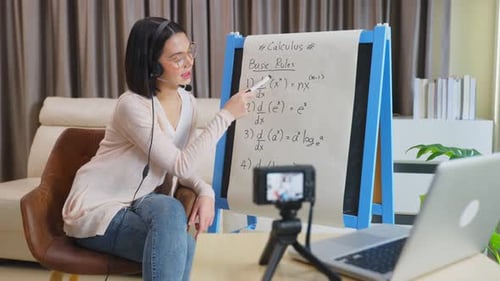 Asian school young woman teacher working from home teach online math subject to student at home.