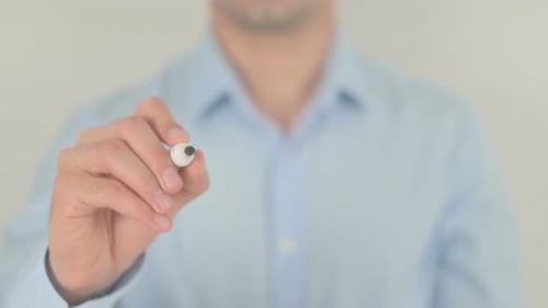 Hand Writes Alert Message on Clear Surface