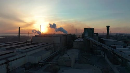 Industrial Zone with White Smoke Is Poured From the Factory Pipe in Contrast To the Sun. Pollution