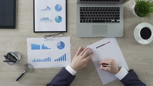 Confident Businessman Writing Business Plan, New Ideas and Strategy, Motivation
