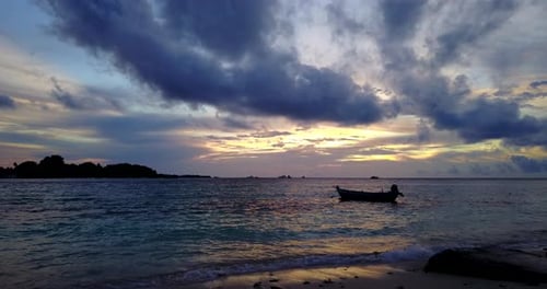 Natural fly over copy space shot of a white sandy paradise beach and aqua blue water background in c