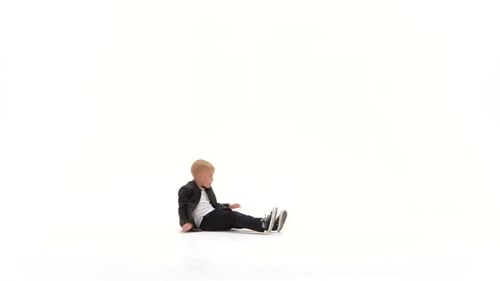 Energetic Boy Breakdancing on White Background