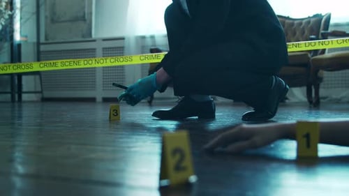 Crime Scene Investigator Examines Evidence with Magnifying Glass