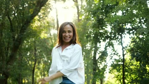 Close Up Portrait of Young Feminine Brunette Girl Smiling and Dancing in Slow Motion. Happy Awesome