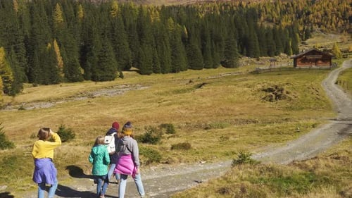Girls Hikers Going By The Trail In The Beautiful Autumn Valley