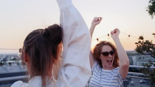 Friends Celebrate at Sunset Rooftop Party