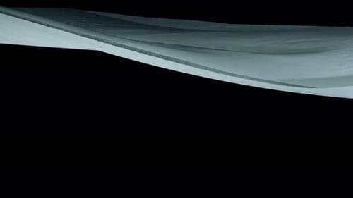 Abstract Flowing Light Blue Surface on Black Background