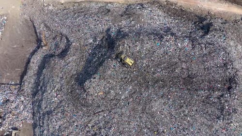Aerial View of Massive Landfill Site with Bulldozer