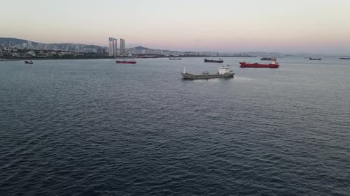 Cargo Ships Sailing on the Sea Toward City