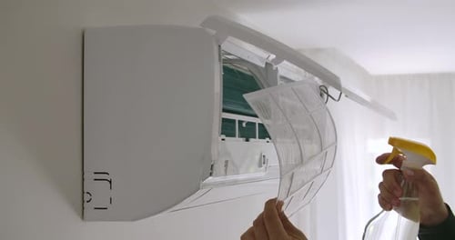 Cleaning an Air Conditioner in Home, Close Up