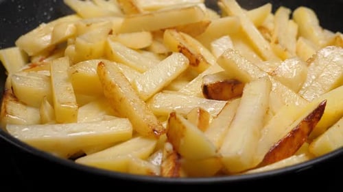 Close up of Potatoes Frying in a Pan