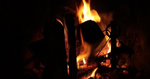 Crackling Fire in a Dark Fireplace