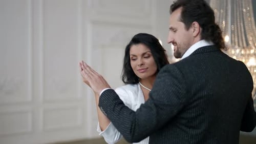 Celebratory Slow Dance of Newlyweds in Wedding Day in White Palace Room Love and Tenderness