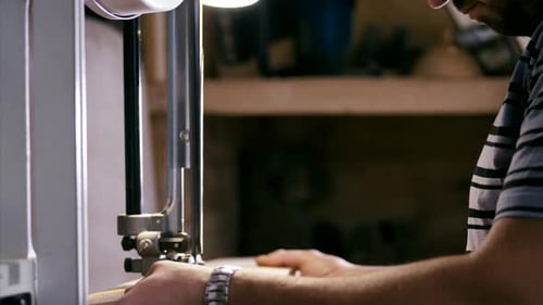 Craftsman Cuts Wood with Precision Machine