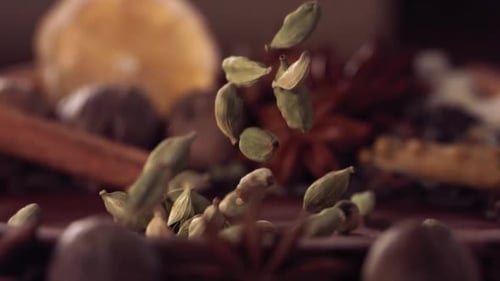 Falling Cardamom Seeds with Spices in Slow Motion