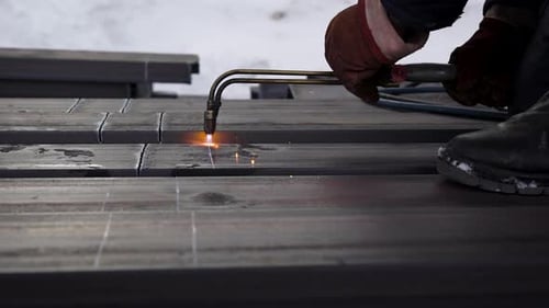 The Builder Cuts the Metal with a Special Burner. Protective Gloves