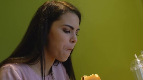 Hungry Woman Biting Tasty Burger, Having Lunch in University Canteen, Junk Food