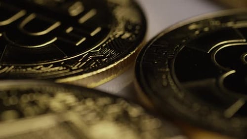 Rotating shot of Bitcoins (digital cryptocurrency) - BITCOIN 0375