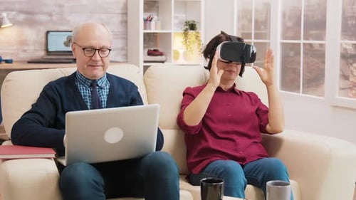 Senior Couple Experiences Virtual Reality with VR Headset