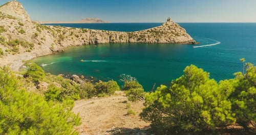 Tourist Vacation Spot in the Bay Tsarsky Beach in Crimea. Boats Sail on the Black Sea Among the
