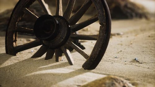Rustic Wooden Wagon Wheel in Desert Sand