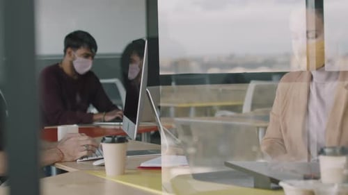 People Wearing Face Masks Working in Office