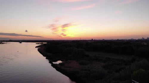 Golden Sky Sunset With Peaceful Nature Scenery Of River On Countryside. - Aerial Wide Shot