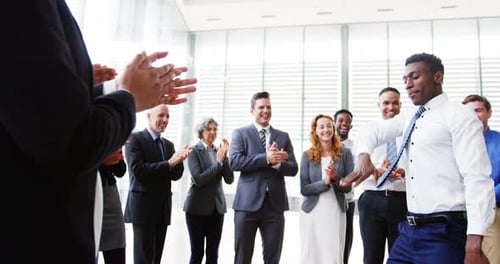 Team Celebrates Colleague with Dance and Applause