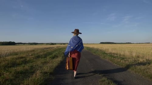 Woman Walks Rural Road with EU Flag
