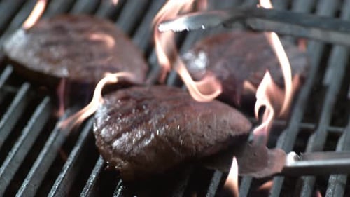 Steak on grill in slow motion, shot on Phantom Flex 4K