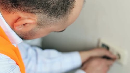 Electrician Repairs Electrical Switch Close Up