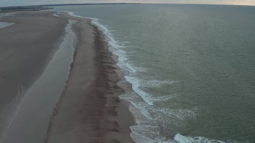 Beautiful Coastline of Northern Belgium Beach on Cloudy Sunset, Aerial Moving Forward