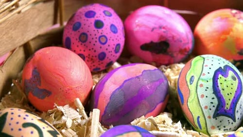 Decorated Easter Eggs in Wooden Basket