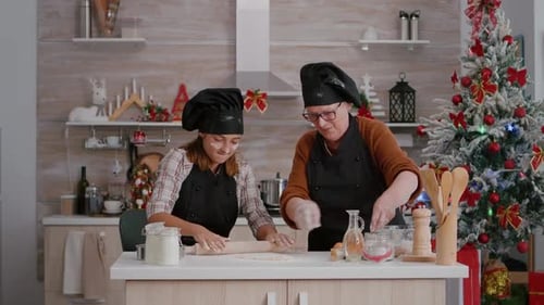 Women Baking Festive Holiday Cookies Together