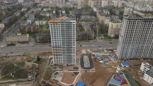 Flying Over A Construction Site In An Arc. Modern Construction Of The City Block.