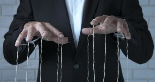 Puppet Master Controlling With Strings in Dim Setting