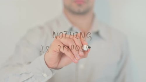 Man Writes "Nothing Is Impossible" on Glass