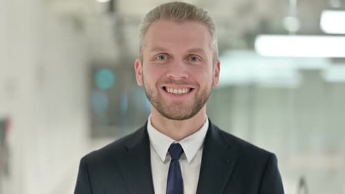Blond Man in Suit Smiling