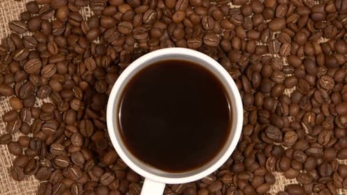 Cup of Coffee with Roasted Coffee Beans