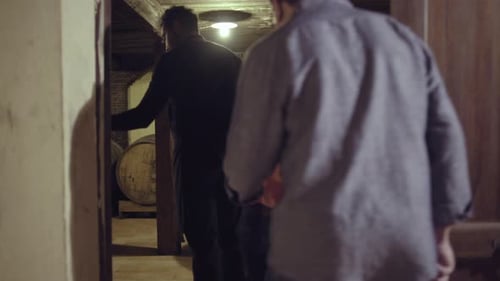 Adults Touring Wine Cellar with Expert