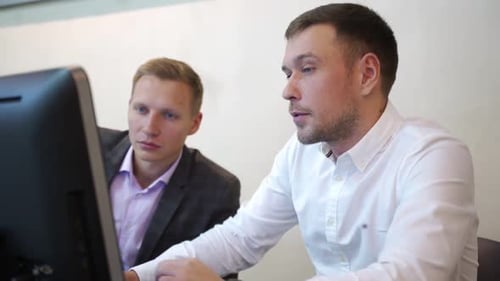 Beautiful Businessman Uses Desktop Computer, Consults Her Project Manager About Documents with