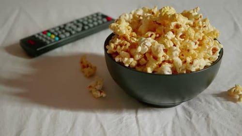 Bowl of Popcorn with a Remote Control