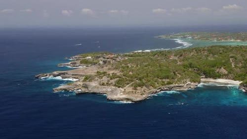 Aerial Drone Flight Over Ocean and Green Bali Island Indonesia